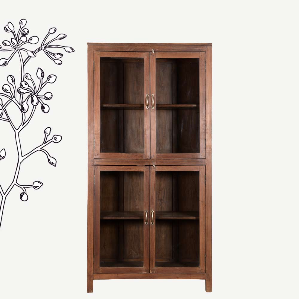 A photo of a brown solid wood cabinet (also know as a press, pantry or dresser) with glass paneled doors and shelves within.